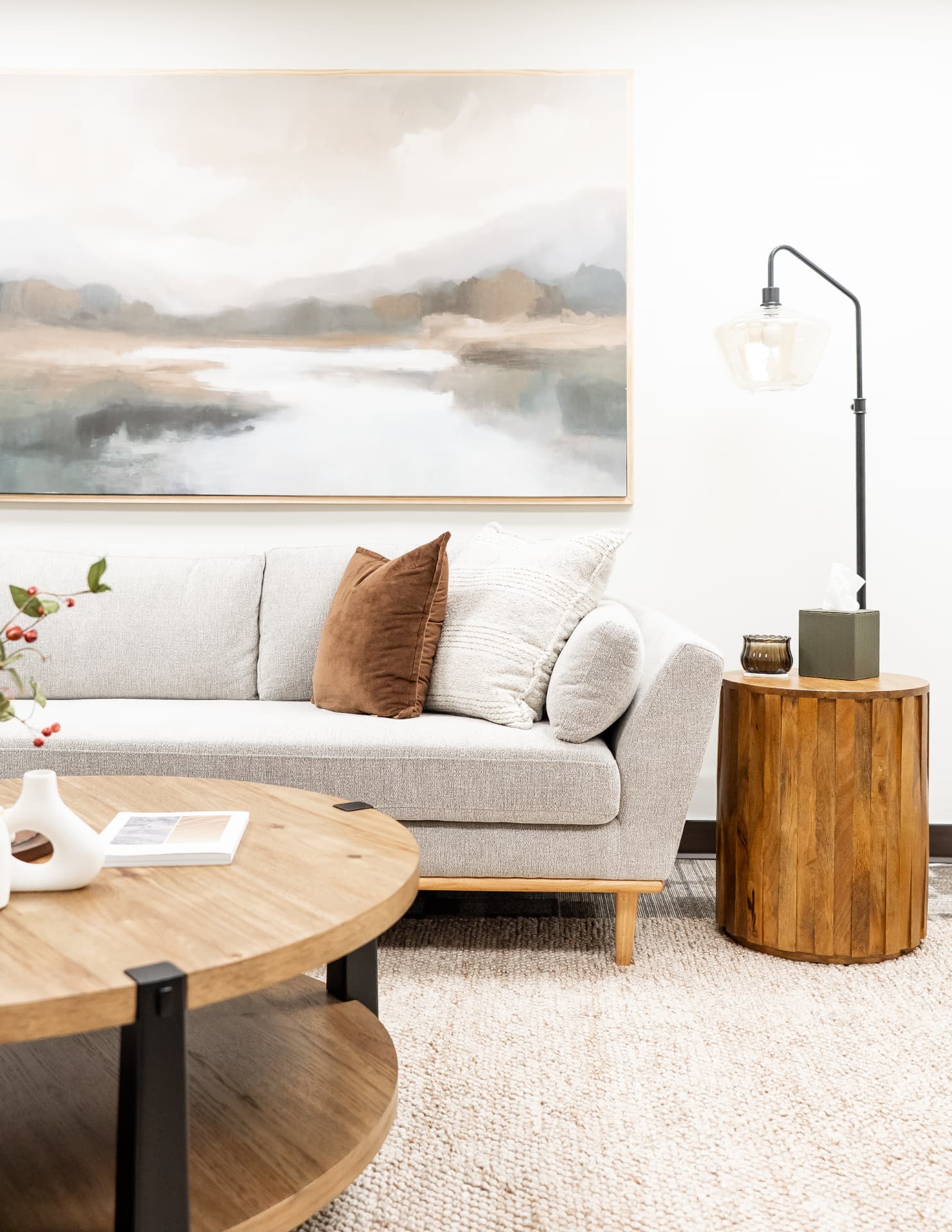 Soft seating and natural wood furnishings in the Missal Wellness studio.