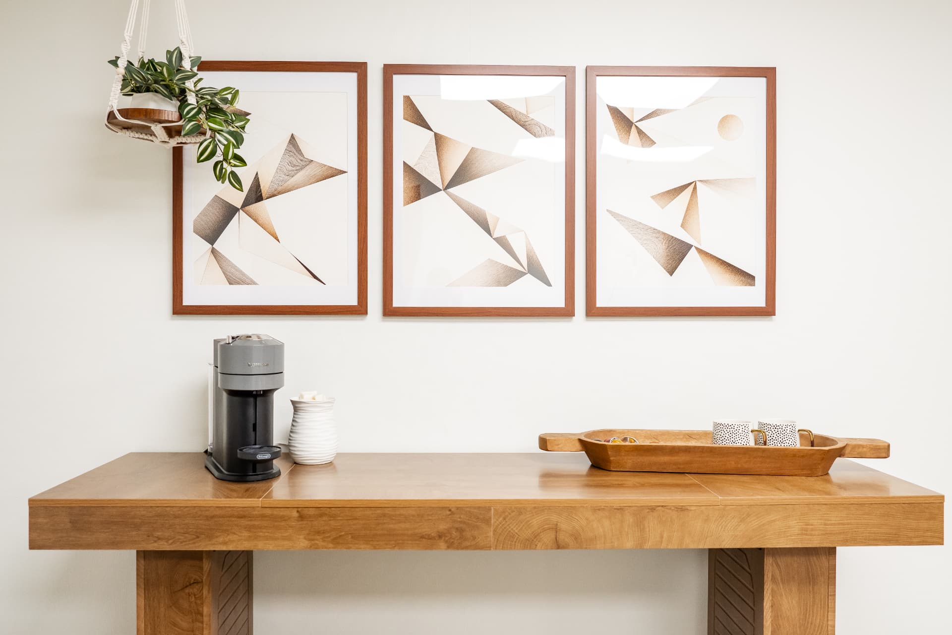 The studio refreshment counter beneath framed geometric artwork.